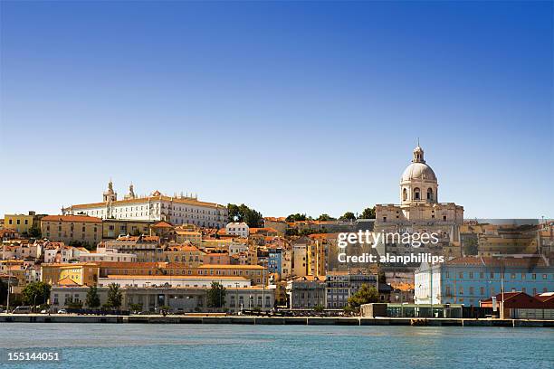the alfama district of lisbon seen from the tagus river - river tagus stock pictures, royalty-free photos & images