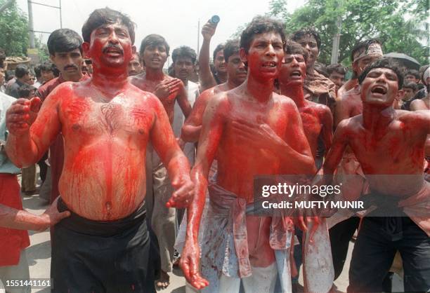 Group of Shiite Moslems, their bodies splattered with blood, stage a mourning march in a Dhaka street 07 May. The Moharram march marks the martyrdom...