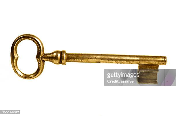 old golden safe key - old fashioned key stock pictures, royalty-free photos & images
