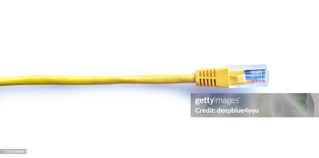 Straight yellow lan cable with plug on white with shadow