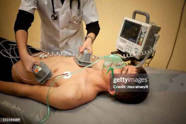 defibrillation - electroshock stock pictures, royalty-free photos & images