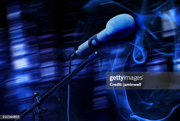 microphone in blue smoky ambiance - mike glad stockfoto's en -beelden