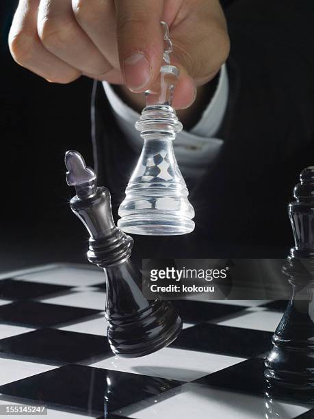 battle on the chess - chess piece stock pictures, royalty-free photos & images