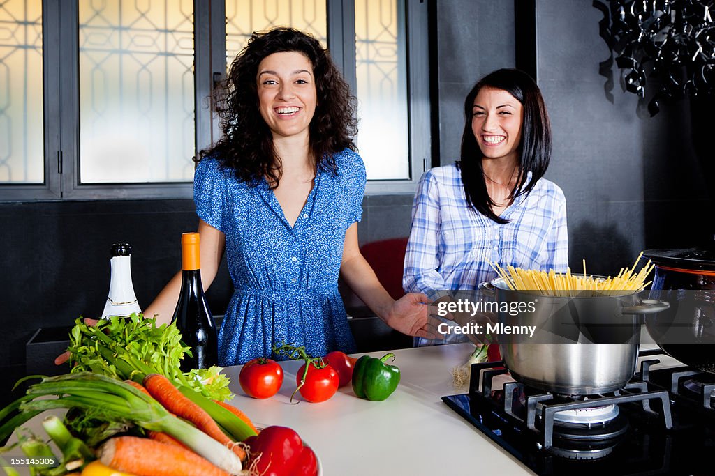 Modern Kitchen Young Women having fun cooking together