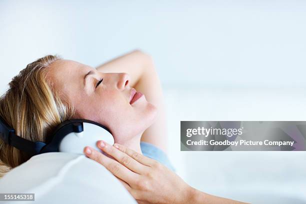 unwinding with music - easy listening stock pictures, royalty-free photos & images