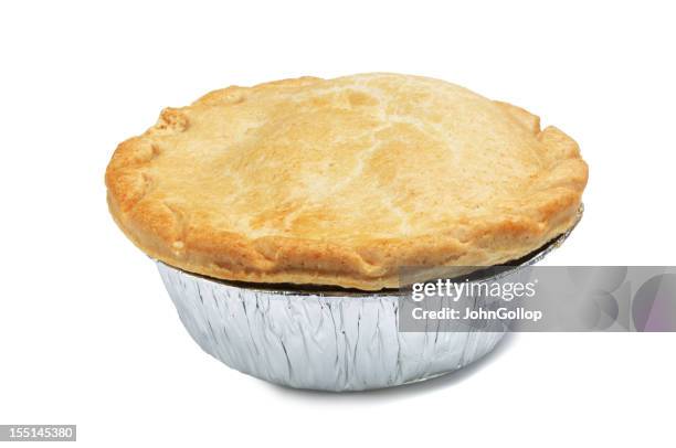 a singular pie in a foil casing - savory pie stockfoto's en -beelden