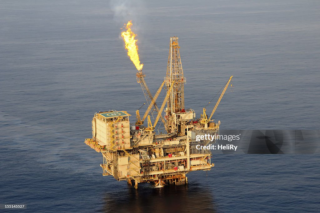 Lone oil rig in middle of sea 