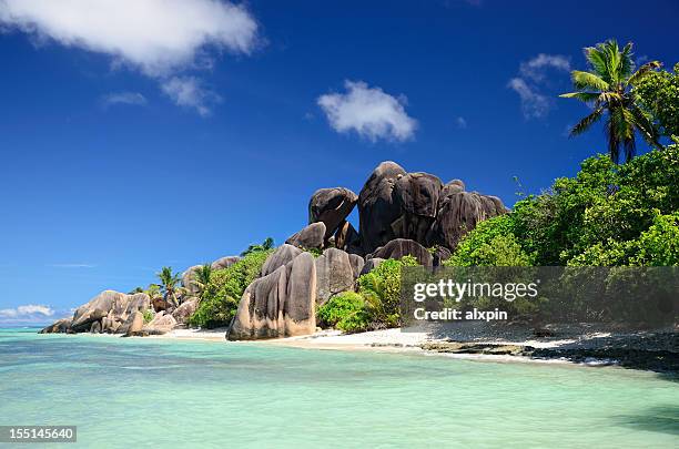 a beautiful beach in the seychelles - seychelles stock pictures, royalty-free photos & images