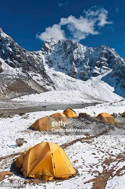 bright yellow expedition dome tents snow mountain camp himalayas nepal - base camp stock pictures, royalty-free photos & images