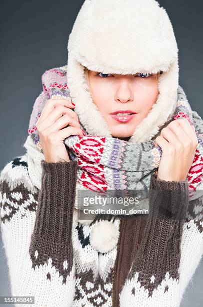 woman in winter clothes is tightly wrapped with cap, scarves - inside human mouth stock pictures, royalty-free photos & images