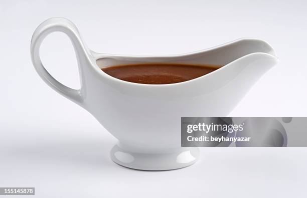 white china gravy boat on white background - gravy boat stock pictures, royalty-free photos & images