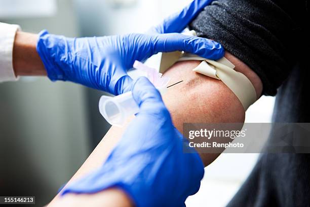 nurse drawing blood - tourniquet stock pictures, royalty-free photos & images