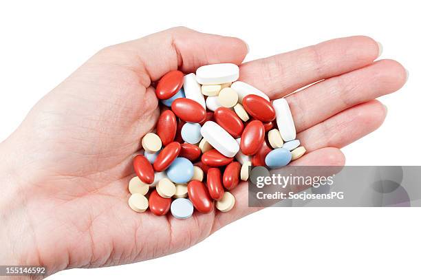 medication on hand - handvol stockfoto's en -beelden