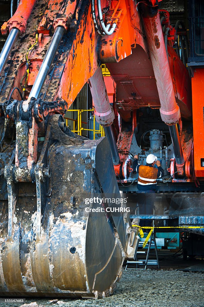 Maintenance on Excavator