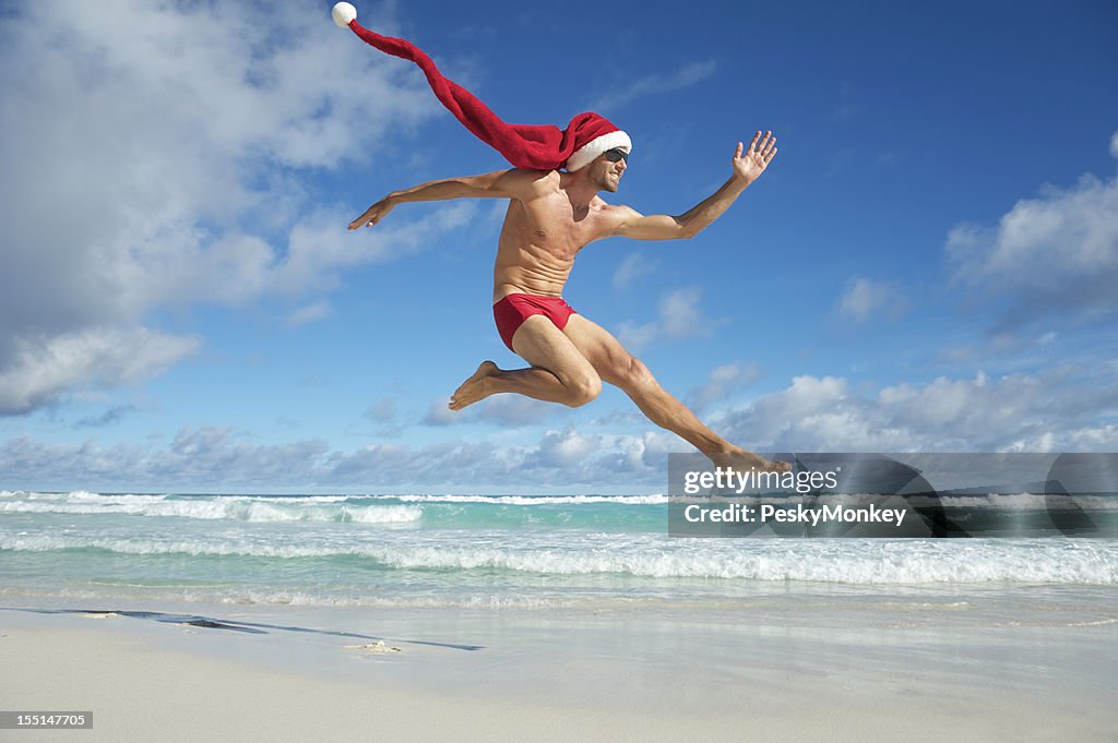 Speedo Santa with Long Hat Runs Across Tropical Beach