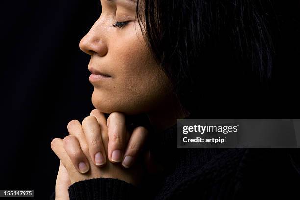 woman praying - prayer solitude stock pictures, royalty-free photos & images