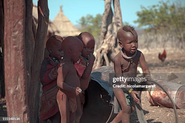 himba children playing - himba stockfoto's en -beelden