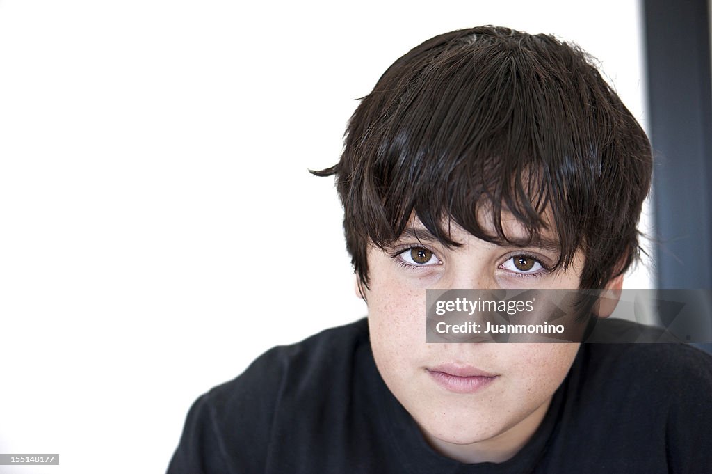 Pensive thirteen years old boy