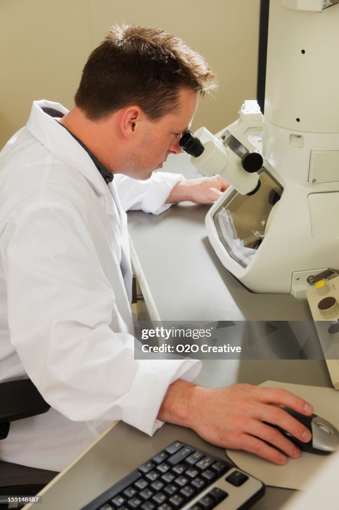 Scientist using an Electron Microscope