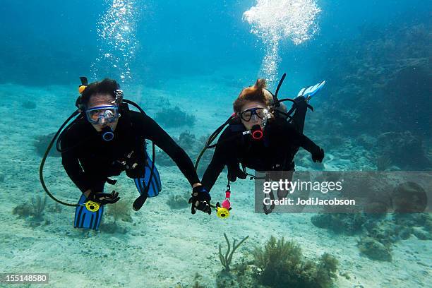 scuba buddy diving - undersea diver stock pictures, royalty-free photos & images