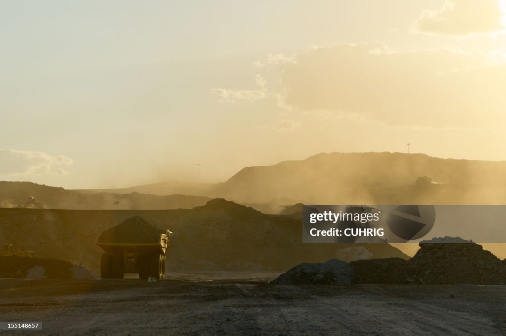 Coal mining truck hauling dirt on a hazy day