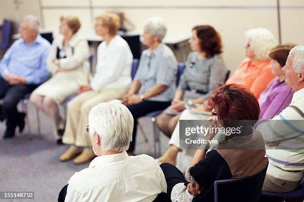 seniors in the community center - group learning stock pictures, royalty-free photos & images