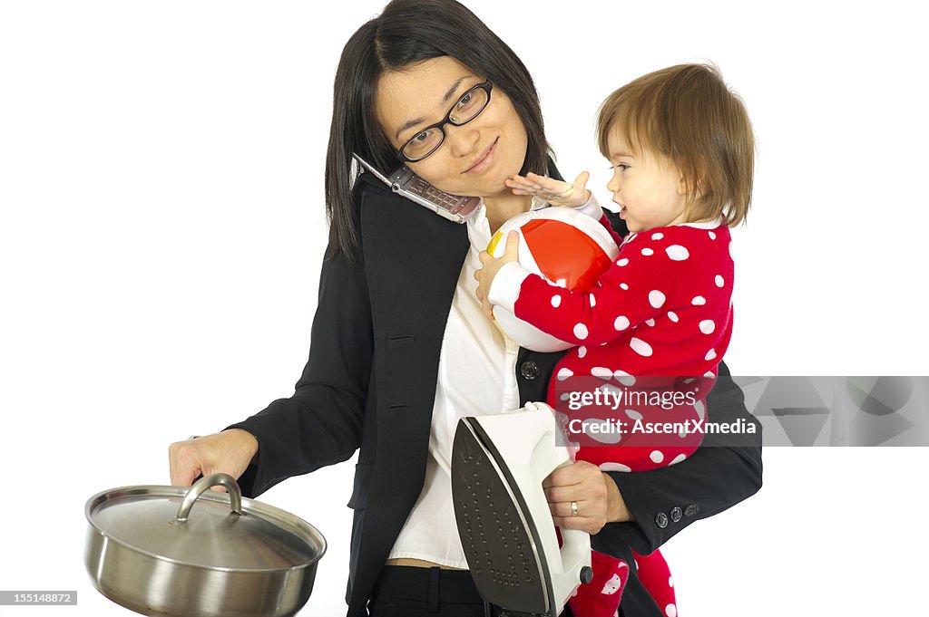 Working mom juggles a child and household chores
