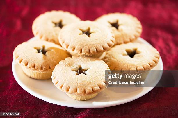 plate of mince pies on red cloth - mince pie stock pictures, royalty-free photos & images