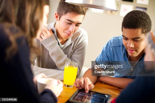 students using a digital tablet - youth club stock pictures, royalty-free photos & images