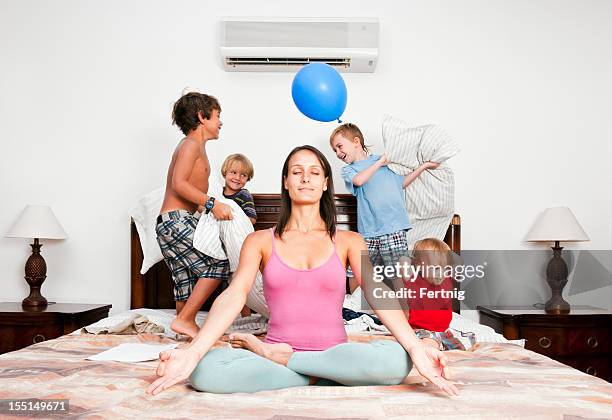 meditation time, yoga, mother, relaxation. - family chaos stock pictures, royalty-free photos & images