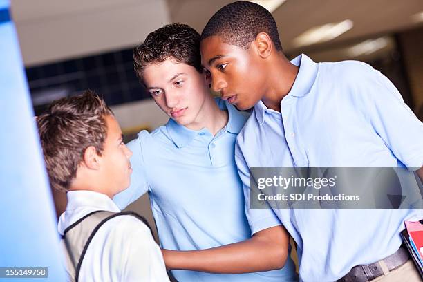 teenage boys bullying a smaller high school student - aggression school stock pictures, royalty-free photos & images