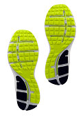 Yellow and black treaded soles of athletic shoes