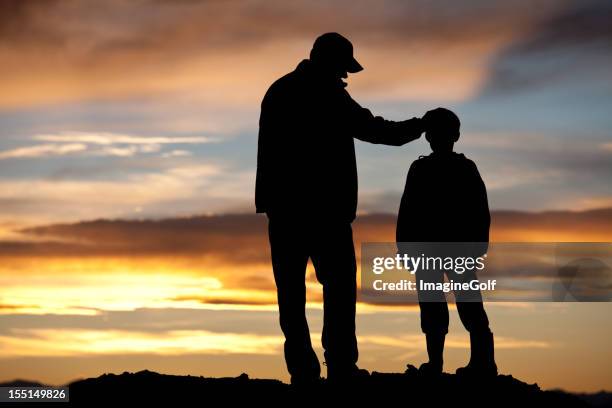 father and son silhouette - role model stock pictures, royalty-free photos & images