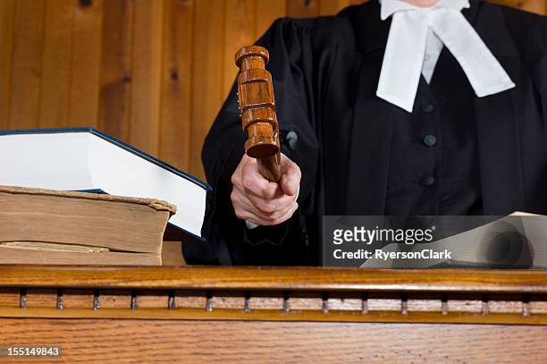 judge in traditional court robes using the gavel. - judge 個照片及圖片檔