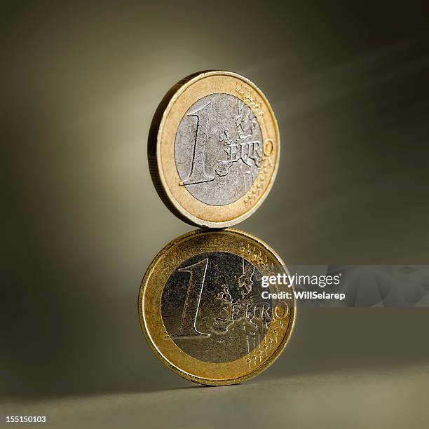 two euros - one euro coin stock pictures, royalty-free photos & images