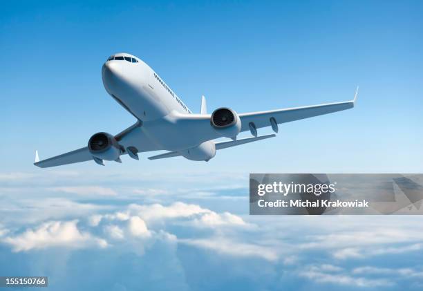 jet avión de pasajeros volando sobre nubes - avion fotografías e imágenes de stock