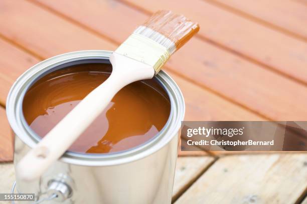 staining hardwood patio deck - wood stain stock pictures, royalty-free photos & images