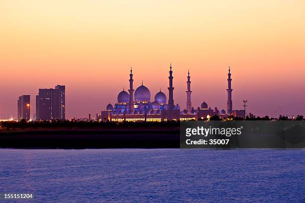a beautiful view of an arabian sunset - abu dhabi mosque stock pictures, royalty-free photos & images