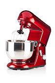 Red kitchen stand mixer shot on white backdrop