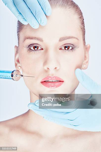 botox is injected  with help  professional practitioners - woman studio shot stock pictures, royalty-free photos & images