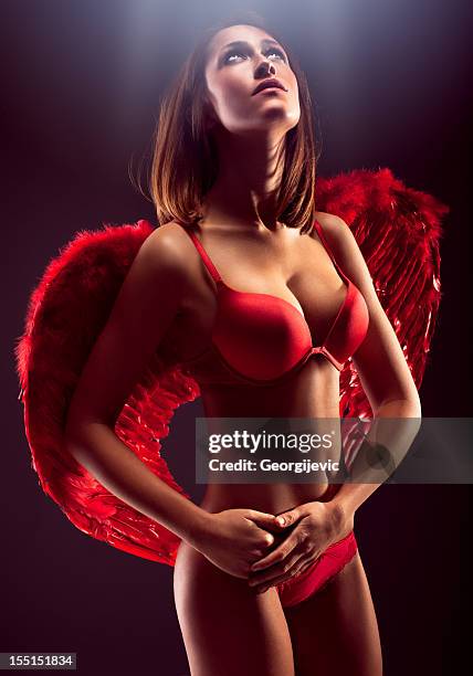 red angel - devil woman stock pictures, royalty-free photos & images