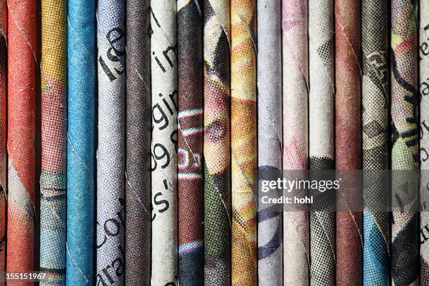 rolled newspaper pages - wallpaper roll stockfoto's en -beelden