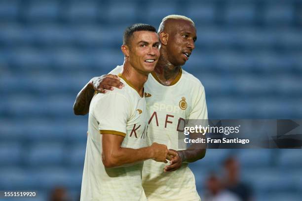 Cristiano Ronaldo interacts with Anderson Talisca of Al Nassr during the pre-season friendly match between Celta Vigo and Al Nassr at Estadio Algarve...