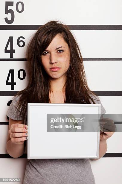 mugshot of a woman - teen arrest stock pictures, royalty-free photos & images