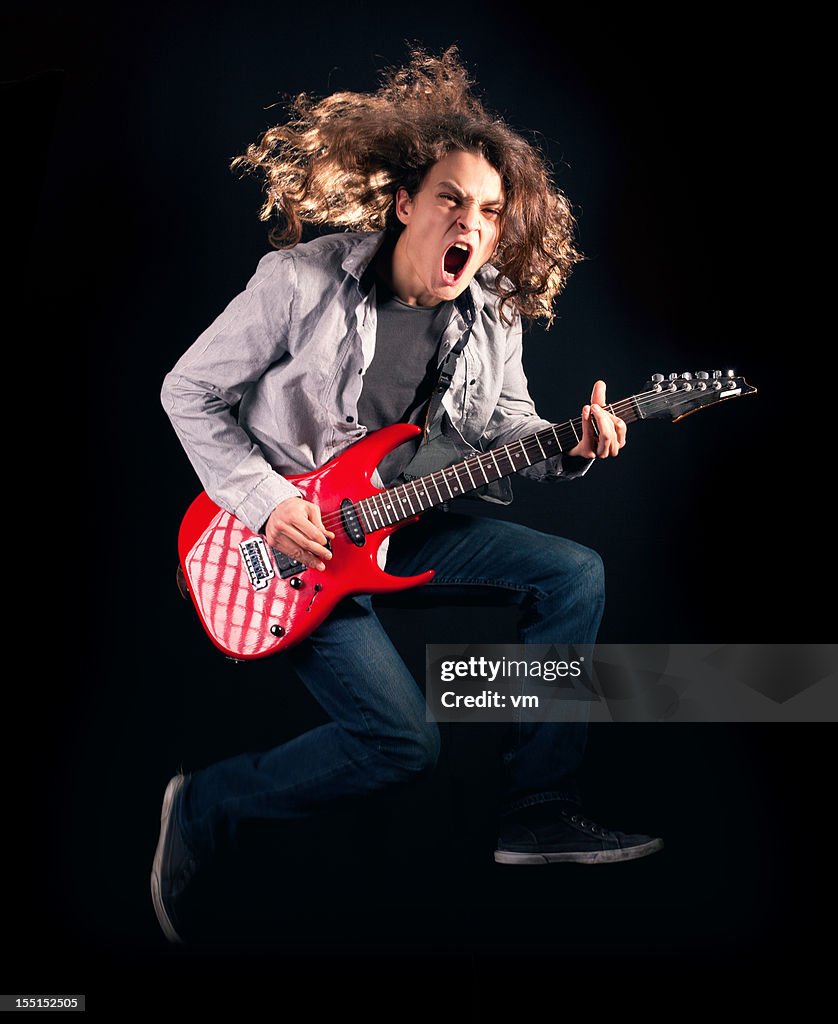 Teenager playing guitar