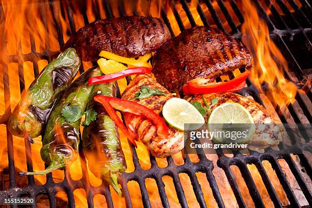 chicken and beef fajitas with flames - broiling stock pictures, royalty-free photos & images