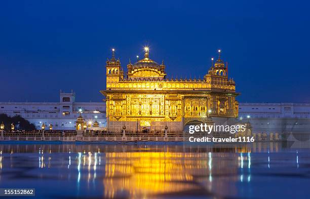 the golden temple in amritsar, india - golden temple india stock pictures, royalty-free photos & images