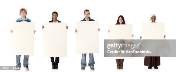 multi ethnic group holding a sign. - one in five people stock pictures, royalty-free photos & images
