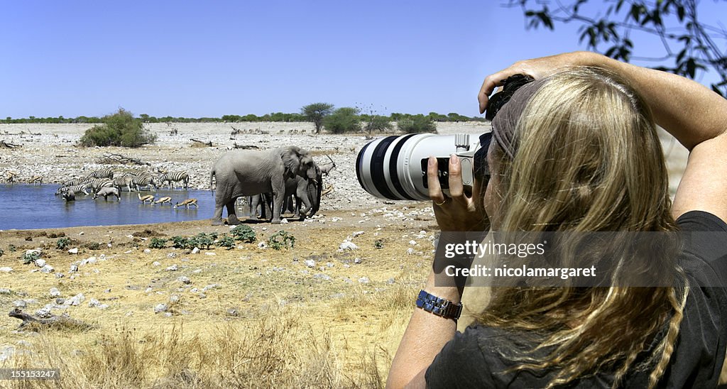 Tourist photographer on safari in Africa