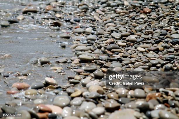 pebbles and sea - pebble stock pictures, royalty-free photos & images